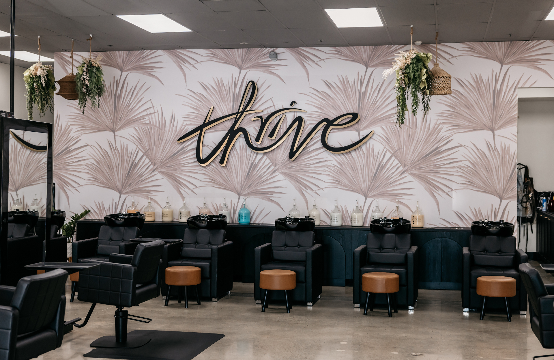 Salon Thrive interior — thrive wall and styling chairs